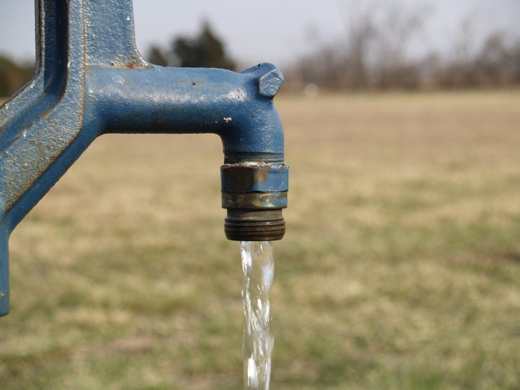 Water flowing from outdoor faucet for vanadium testing