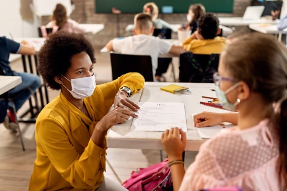 Instructor Discussing Test Results with Student in Classroom