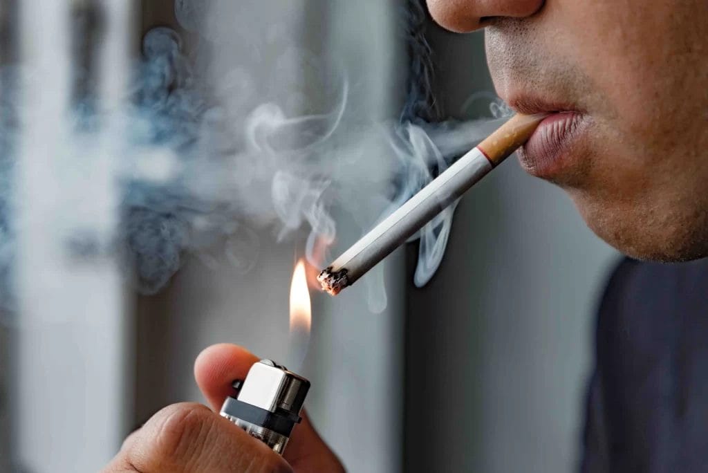 Man Smoking Cigarette for Tobacco Air Testing Service